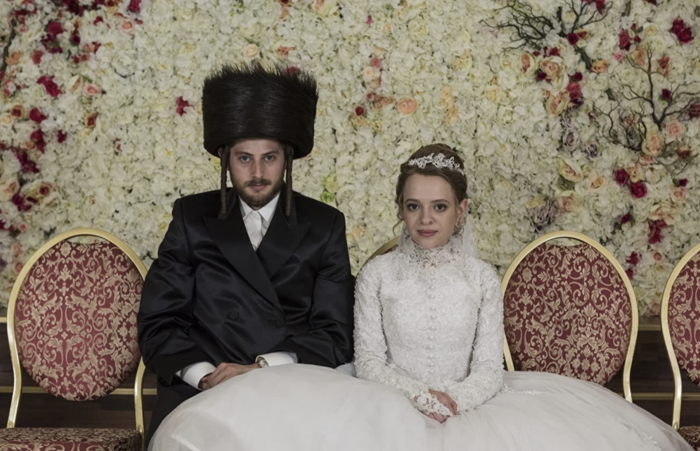 Imagen de Esty posando frente a la cámara el día de su matrimonio.